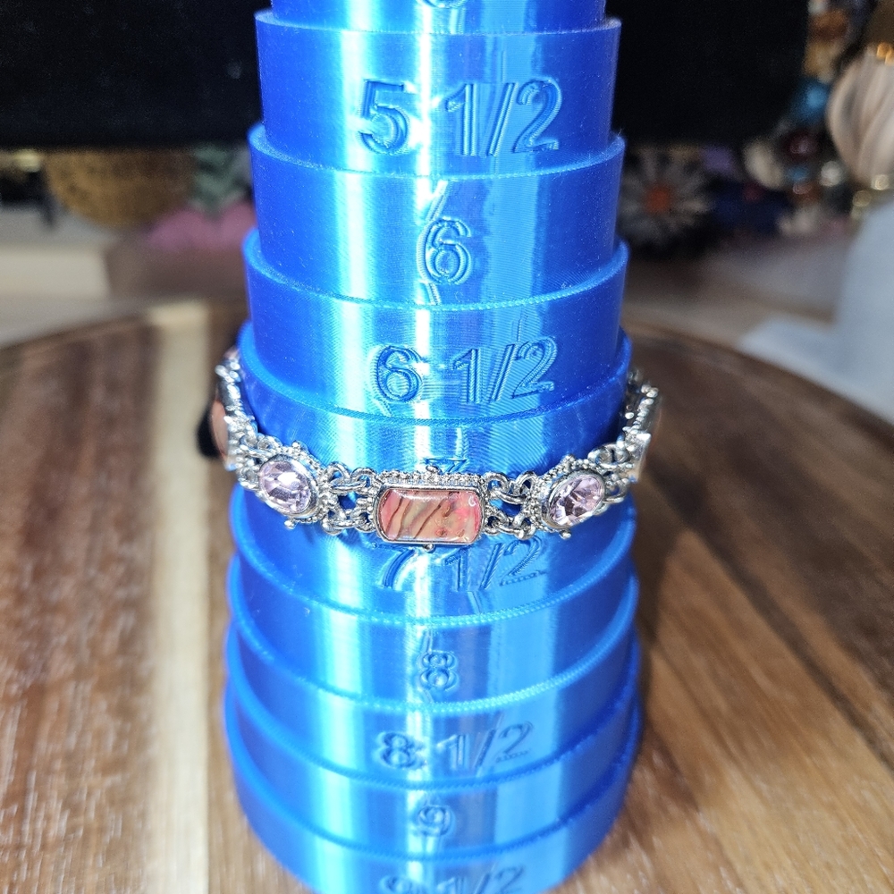 This gal is sooooo pretty. Silver tone, toggle clasp Bracelet